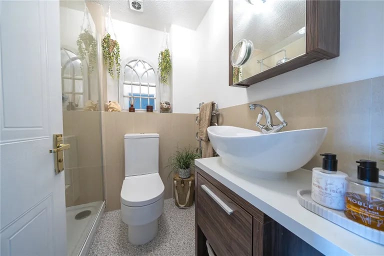 Here is also the house bathroom with stylish wash hand basin.