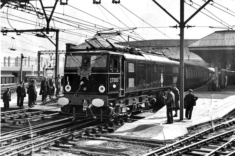 The first electric train pulls into Victoria Station in September 1954. The black and red locomotive No.27000 was driven by Frank Laming. 