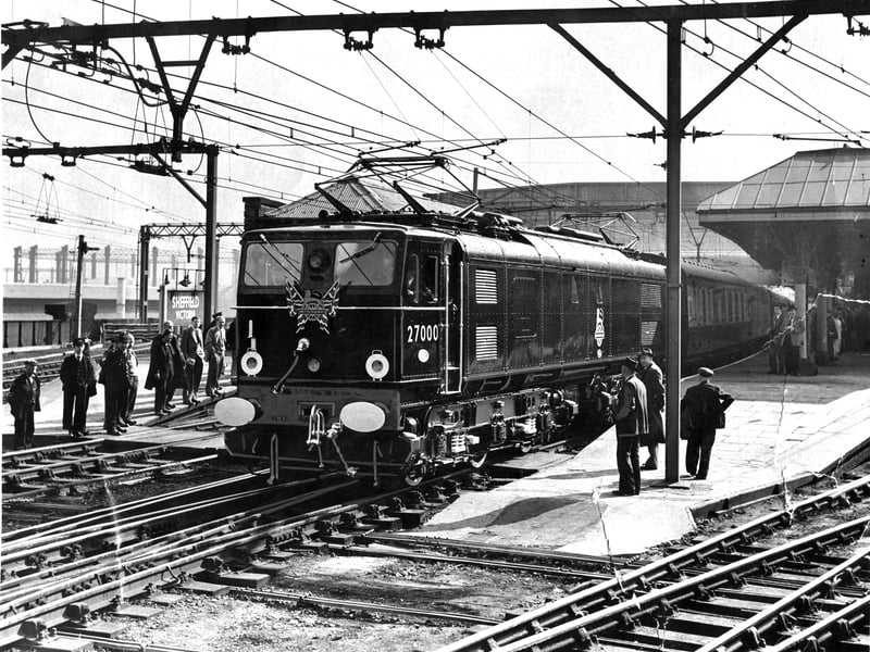 The first electric train pulls into Victoria Station in September 1954. The black and red locomotive No.27000 was driven by Frank Laming. 