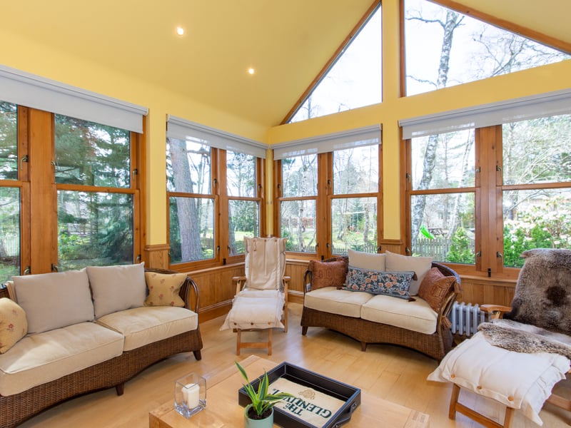 Exterior: The property’s attractive garden is entered via a gated entrance and is surrounded by mature trees. There is a sun terrace and barbecue area, double garage, and a colourful array of shrubs and lawns.