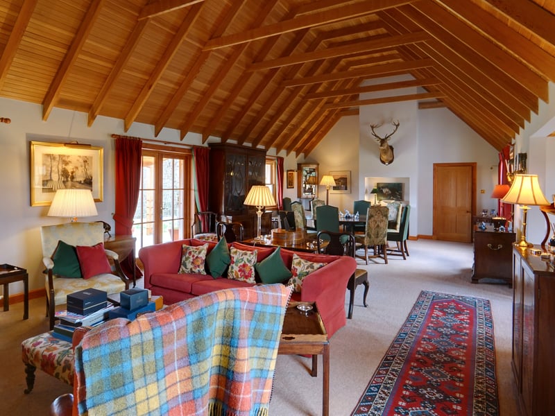 Interior: Two hallways lead to Backharn’s traditional-style kitchen and family room, complete with cosy wood-burning stove. There is a drawing room with full-height ceiling and six bedrooms, one of which is in use as a study.