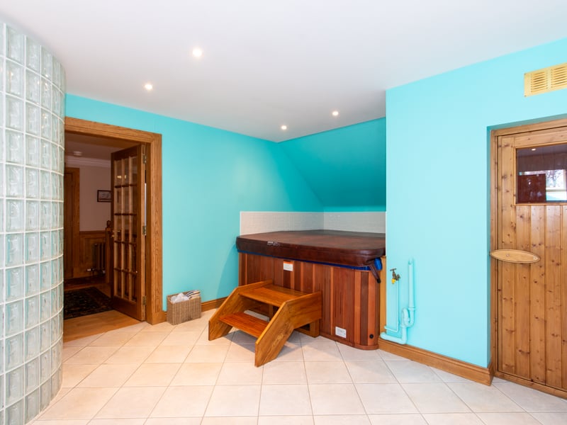 The spa area creates a peaceful atmosphere and a hot tub, sauna and dedicated drinks preparation area against the backdrop of the Balnagowan Woods.