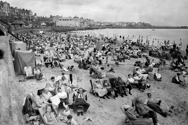 A busy beach on the resort's south side pictured in June 1954.