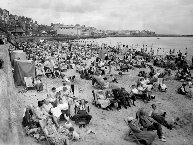 A busy beach on the resort's south side pictured in June 1954.