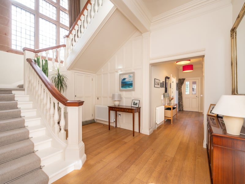 Original features include fireplaces in four rooms, elegant columns in the kitchen, a Jacobean-style broad staircase, which originally served the whole building, and leaded pane windows that ensure the home is bright throughout the day.
