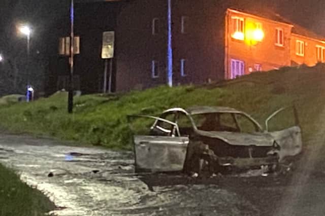 The remains of the car set alight on Kenninghall Drive, Arbourthorne