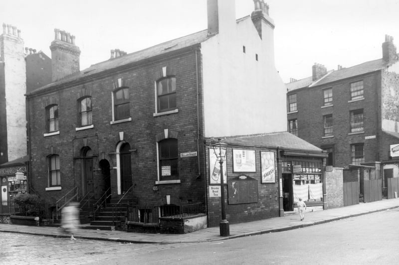 Looking across Willow Terrace Road, Hillary Street is on the left, the two houses are numbers 89 then 95. Behind lay 91, 93. The grocers shop at 17 Willow Terrace Road is the business of N. Firth. On the right is Fenton Place, this is the back of Fenton Street. Pictured in August 1960.