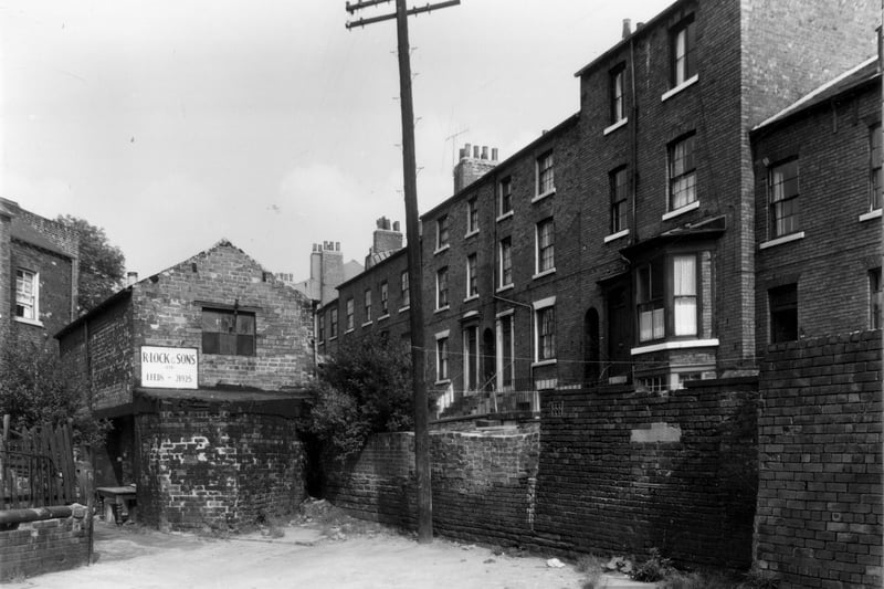 This is the end corner of Back Blundell Street, number 16/17 is the single storey building with the name R. Lock Ltd on the board. This was a decorators business. On the right is Fenton Street, this is the rear view. Pictured in September 1960.