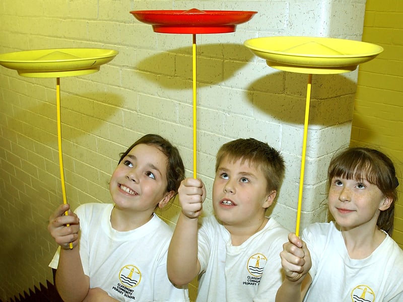 Blackpool Circus School at Claremont Primary School, Blackpool. From left, pupils Mizkha Rogan (8), Connor Buchan (8) and Casey White (8) learning plate spinning