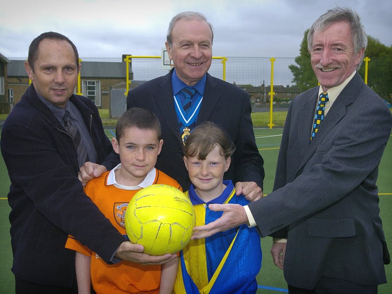 Footballing legend Jimmy Armfield was at Mereside Primary School to officially open the school's new Lottery funded all-weather pitch. Pictured are pupils Michael Sladen and Samantha Hatton with L-R: Property and Development Officer Blackpool Council Brett Cheetham, Jimmy Armfield and Head Steve Burton