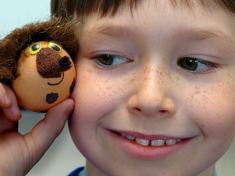Eight year old Nathern Benson with one of the decorated eggs made and looked after by St Nicholas CE Primary School (Blackpool) pupils, which raised £1,422 for Barnardos