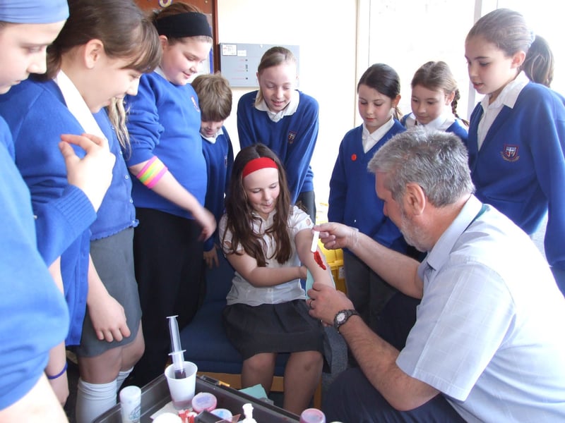 Pupils learn first aid techniques with John Ackerley, Blackpool and Fylde College's first aid trainer at St Thomas Cof E Primary School