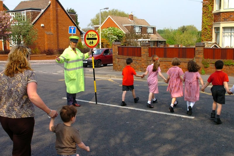 'Lollipop Lady' Bridie Matley outside our Lady of the Assumption Catholic Primary School, Blackpool. / school crossing patrol