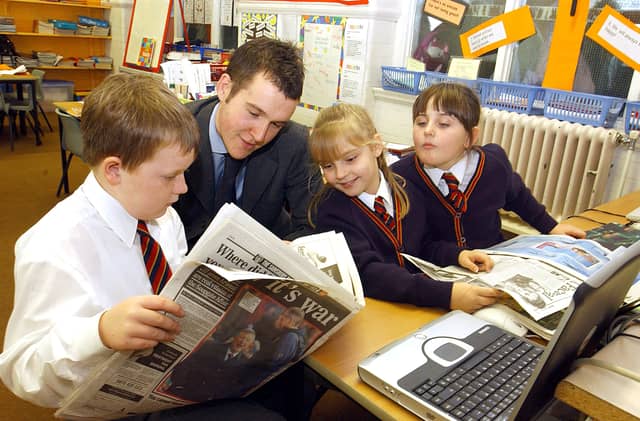 Former Gazette reporter Andy Sykes talks to children at Waterloo Primary School in Blackpool about life working at a newspaper. L-R are Sophie Fletcher (9), Rachel Clarke (9) and Ryan Clarkin (8)