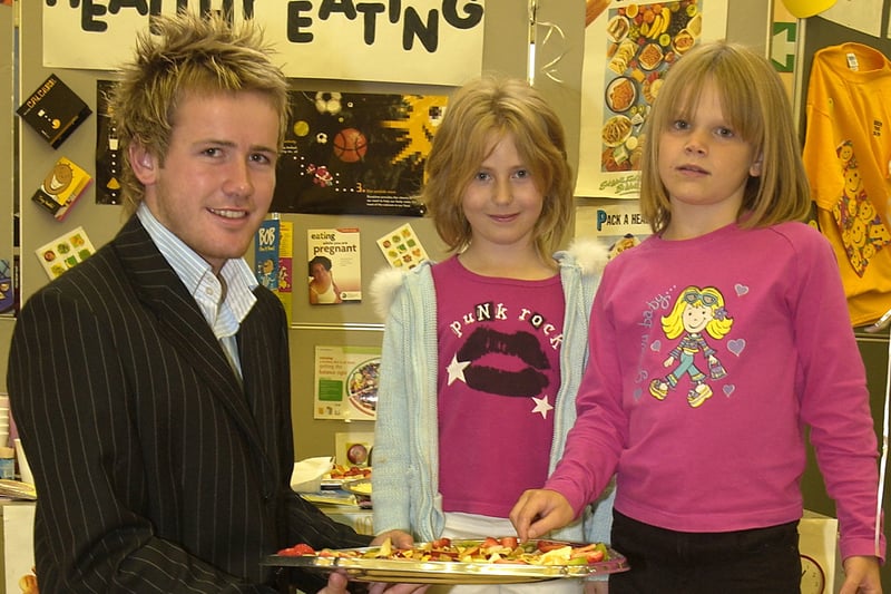 Family physical fitness fun day at Claremont Primary School in Blackpool. L-R are Ciaran Donnelly holding a tray of fruit at a healthy eating stall. Next to him are Kirsty Hale (middle) and Sophie Bickerdike (both 9).