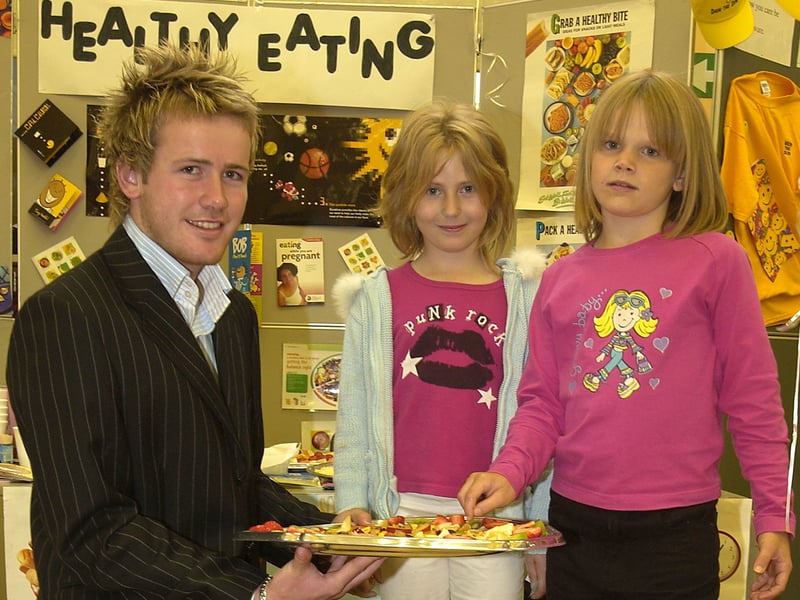 Family physical fitness fun day at Claremont Primary School in Blackpool. L-R are Ciaran Donnelly holding a tray of fruit at a healthy eating stall. Next to him are Kirsty Hale (middle) and Sophie Bickerdike (both 9).