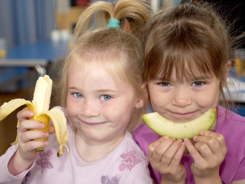Parents join kids for breakfast and games at St Cuthbert's Primary School in Blackpool. Picture od sisters 5-year-old Chloe Gaynor (left) and 6-year-old Sharnelle Gaynor