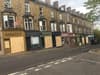 Man arrested over 'weapon attack', as shops open with boarded windows