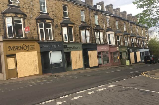 Boarded up shops on Glossop Road, after a suspected vandal attack. Photo: Alan Tenanty