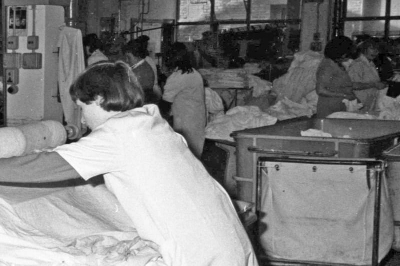 Hard at work in the laundry in 1981. Tell us if there is someone you know in the photo.
