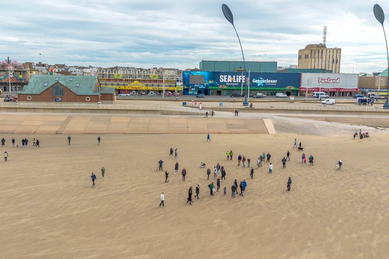 Volunteers spread out across the sands to pick up the rubbish