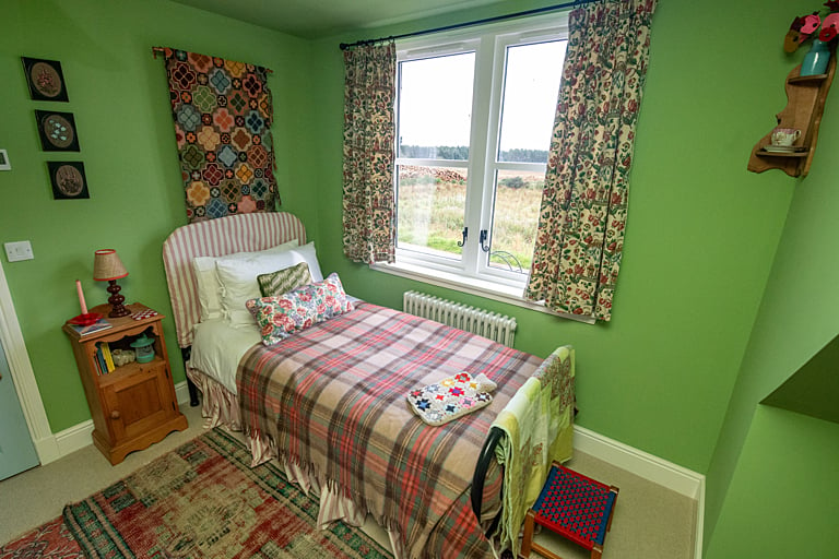 The bedroom enjoys views over the surrounding countryside.