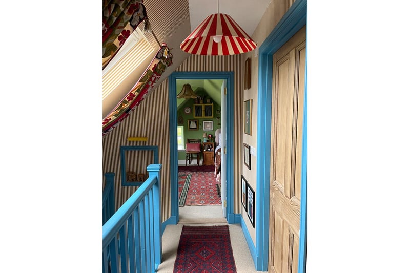 The hallway at Quiney Cottage demonstrates Rachel's love of bold patterns and bright colours.