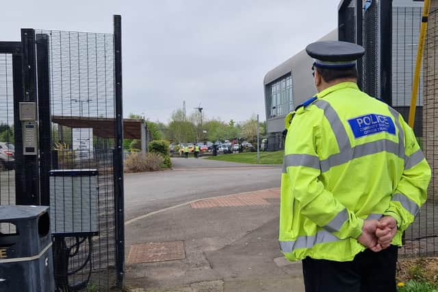 A police officer outside Birley Academy, on Birley Lane, Sheffield, following an incident on Wednesday, May 1 in which three people were injured. A boy, 17, has been arrested for attempted murder
