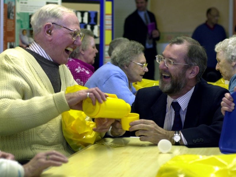 Tea for two in February 2001. Leeds West MP. John Battle, shares a joke with pensioner Arthur Ovenden at the launch of Armley Open Hands 'Winter Warmth Campaign' at Highfield Methodist Church.