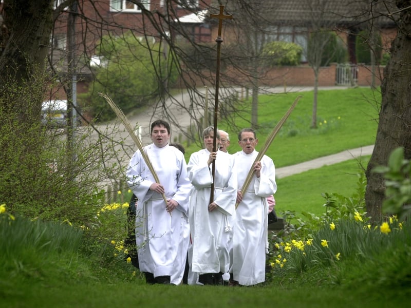 The Palm Sunday Procession walks through the grounds of St John the Evangelist Church on Dixon Lane Road in March 2002.