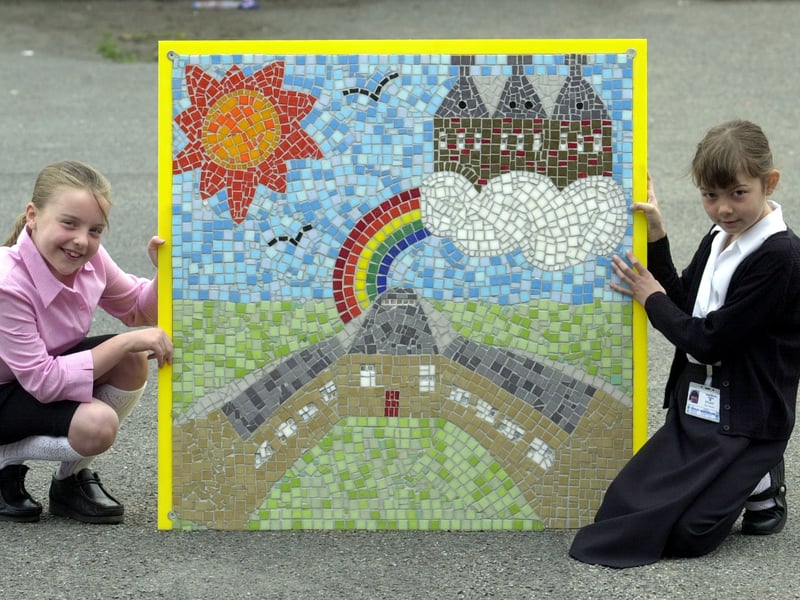 Upper Wortley Primary pupils Amelia Phillips and Holly Wilson with a mosaic which was to take pride of place at the entrance of their new school. Pictured in May 2002.