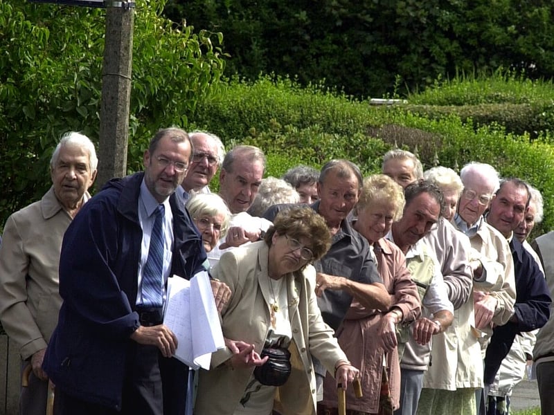 Leeds West MPJohn Battle, front, pictured with local residents at an under threat bus stop on Green Hill Lane in August 2003.