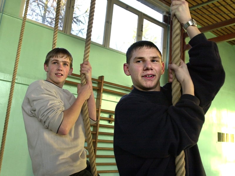 Pupils .Robert Jeffrey, left, and Daniel Burn, pictured on the climbing ropes in the school's gym in December 2001.