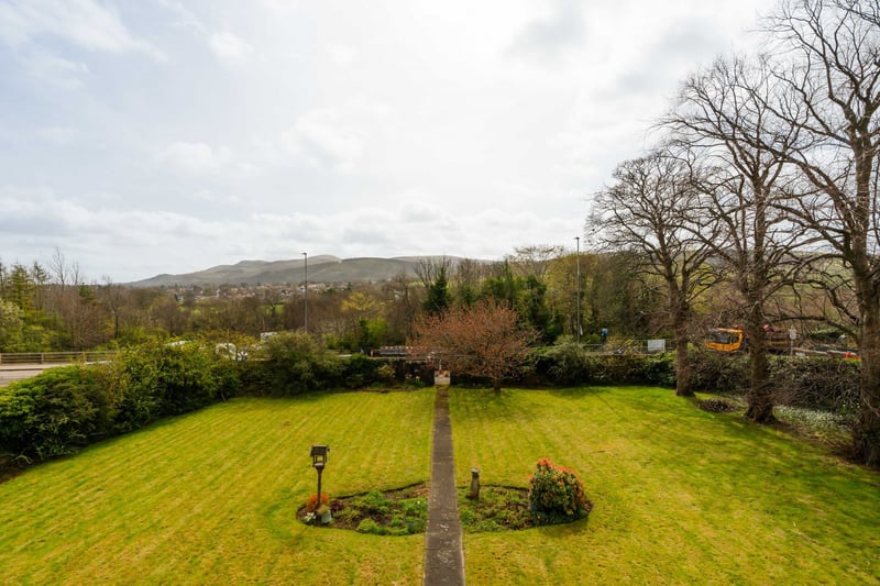 The property is surrounded by magnificent mature gardens, comprising areas of lawn, peppered with shrubs, trees and flowers. An extensive driveway and detached double garage provide excellent off-street parking/overspill storage.