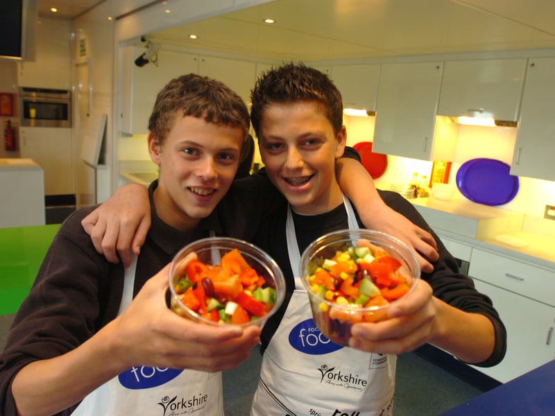 Joe Foster and Zach Gould, with their salad, on the Cookery Bus, at Tapton School, Sheffield