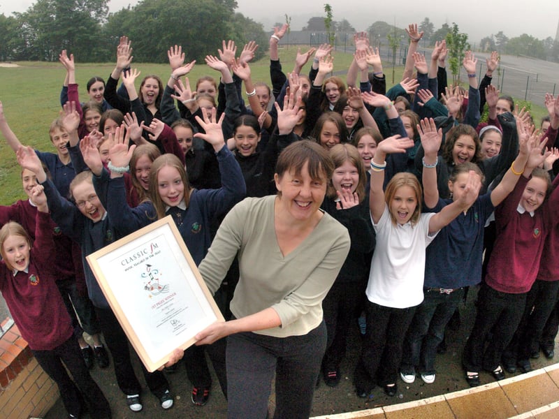 Music teacher of the year Helen Cowen pictured with her lower school choir at Tapton School in June 2005