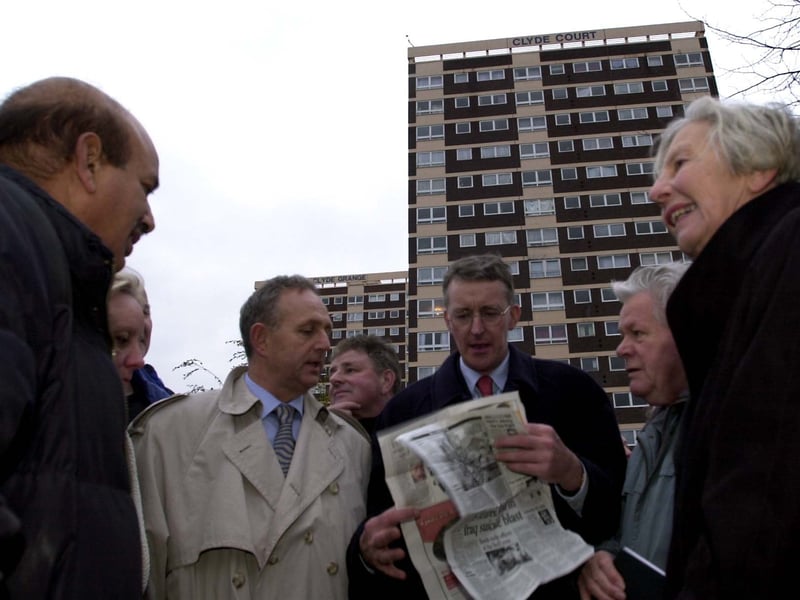 MP Hilary Benn, centre, and Coun Keith Wakefield, centre left, meet local councillors and officials of the New Wortley Residents Association in front of Clyde Court in November 2003.