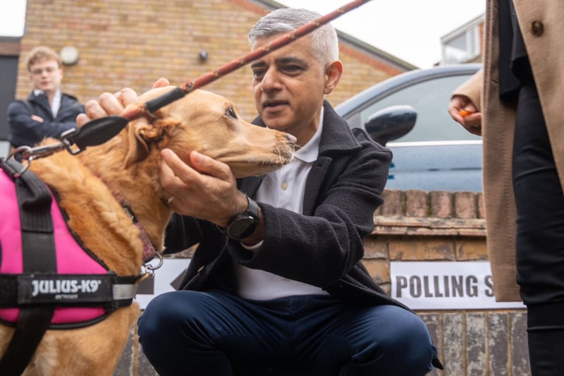 Sadiq Khan arrives at his local polling station with his dog Luna to cast his vote.