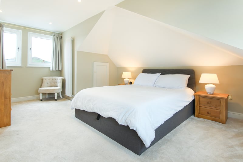 The dual aspect master bedroom with luxury en-suite bathroom and eaves storage encompasses the entire upper floor.