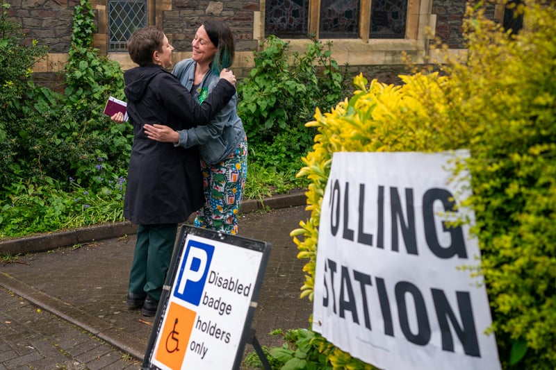 Green Party co-leader Carla Denyer hugs Green Group leader and Green Party candidate for Bishopston and Ashley Down, Emma Edwards, after casting her vote at a polling station in Bristol, in the local elections.