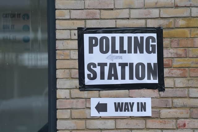 A sign marks the entrance to the polling station at St Albans Church, south London, where people are casting their votes in the local and London Mayoral election.