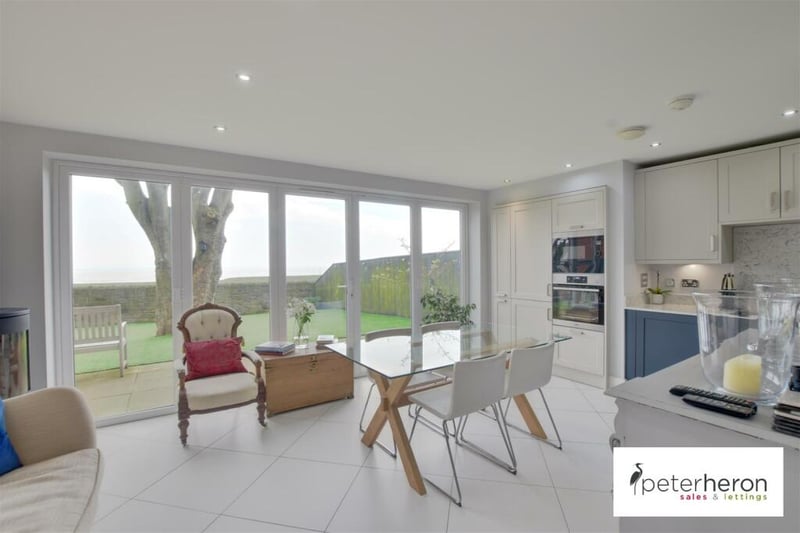 The open plan kitchen/dining area is well lit, with bi-folding doors that lead through to the rear garden.