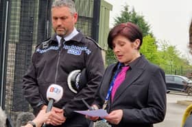Assistant Chief Constable Dan Thorpe reads out a statement at the school gates as he is joined alongside Birley Academy headteacher Victoria Hall.