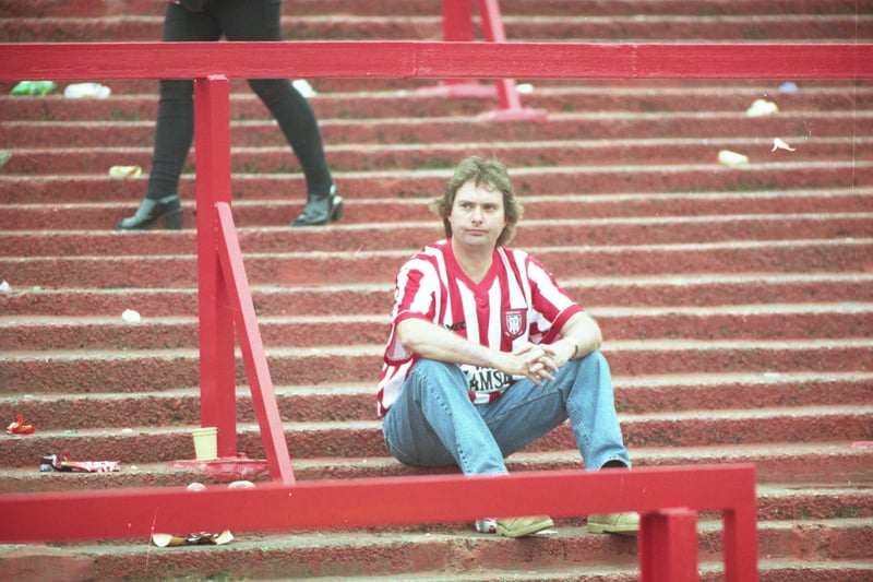 Sean Dempsey takes time for one last moment on the terraces.