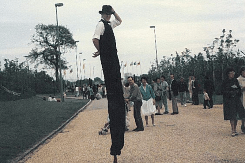 Man on stilts at Liverpool International Garden Festival.