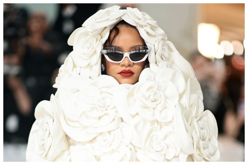 Dressed in a 3D Camellia Valentino Hooded dress, Rihanna certainly attracted attention at the Met Gala 2023, but I was not a fan of the look! She accessorised it with white sunglasses with false eyelashes attached to the lenses