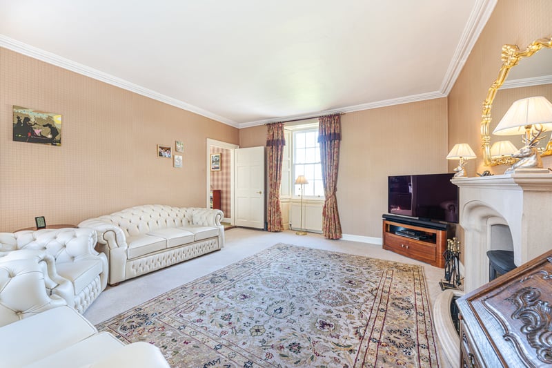 The accommodation is set over three storeys with the ground floor giving way to a good-sized drawing room lit by a large bay window, a formal dining room with attractive Palladian arched glazing, and an open-plan kitchen with family area leading to a snug and office.