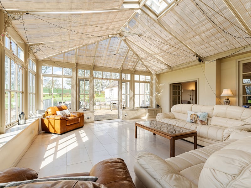 The elegant conservatory was used as a wedding location for the current owner's daughter and the surrounding gardens provided the ideal setting for photographs.