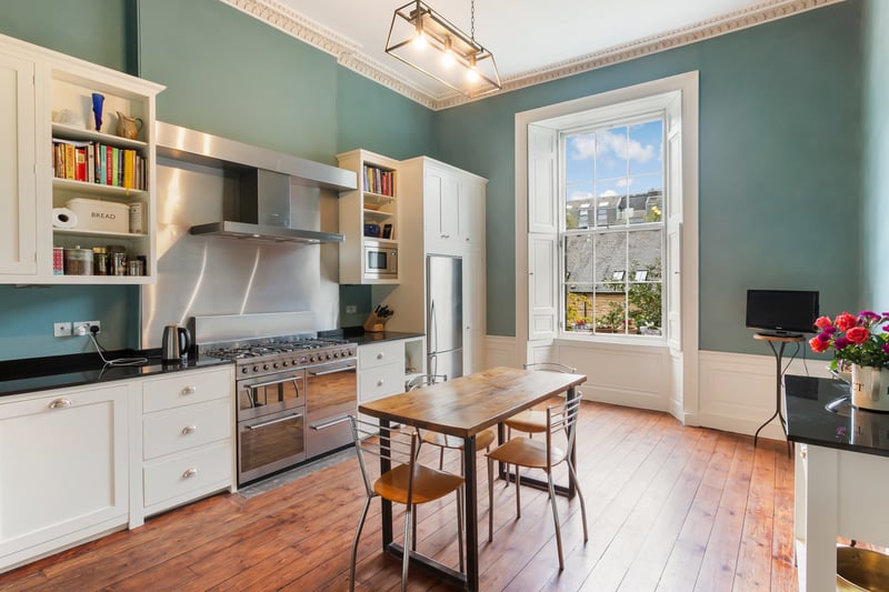 Interior: A ground-floor hall leads to a lounge and drawing room, which are connected by double doors. The apartment’s modern kitchen has a range-style cooker, and there is a formal dining room. Its four bedrooms are all on the lower-ground level, above a home cinema and music room.