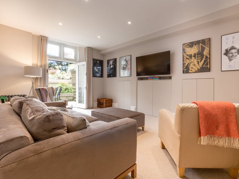 There are double doors in the family area leading to the private rear garden.
